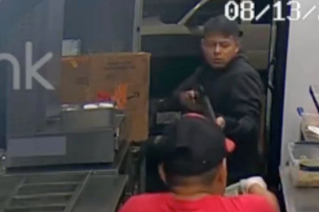 Surveillance footage of the suspect robbing a food truck.